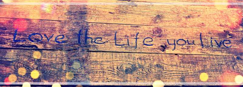 "love the life you live" hand-carved wooden sign for the lake house