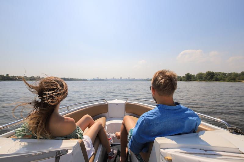 Couple enjoying sun on a boat 