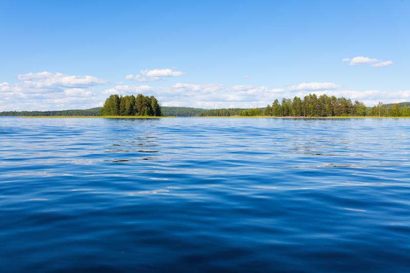 Beautiful blue lake in a sunny summer day